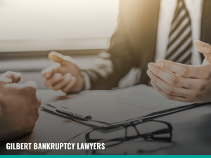 Man tracking the stages of chapter 7 bankruptcy with a Gilbert bankruptcy lawyer