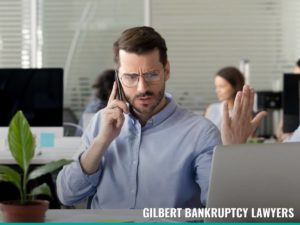 Man receiving a debt collector call