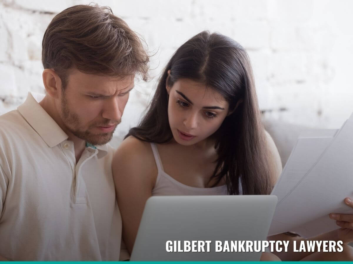 Married couple trying to understand the stages of filing for bankruptcy with tips from Gilbert Bankruptcy Lawyers blog